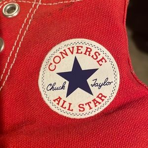 Gently used red high top converse shoes. Unisex.